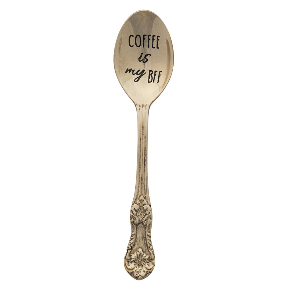 Vintage brass spoon engraved with Coffee is my BFF on a white background.