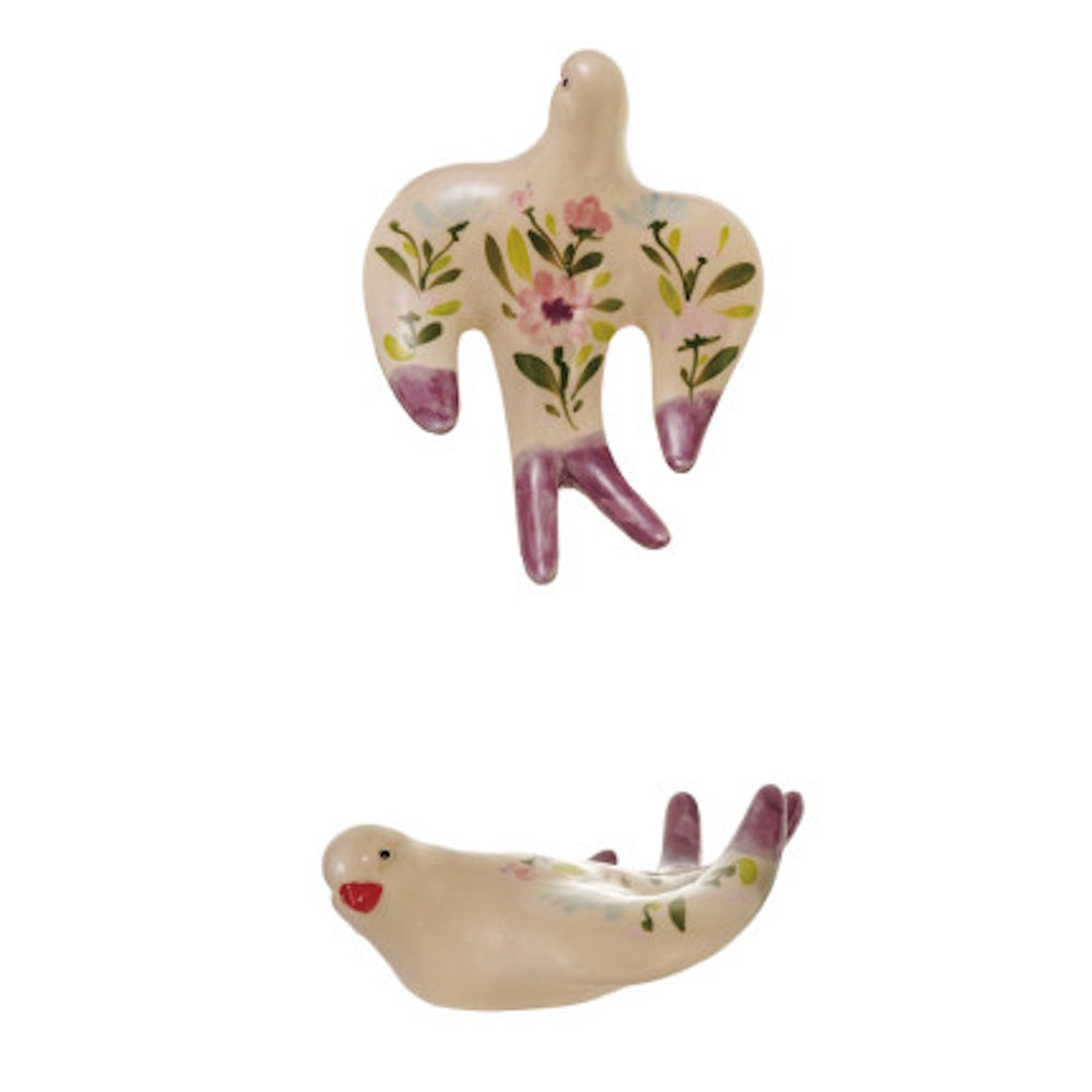 Two ceramic bird wall decorations with hand-painted pink and green floral patterns.