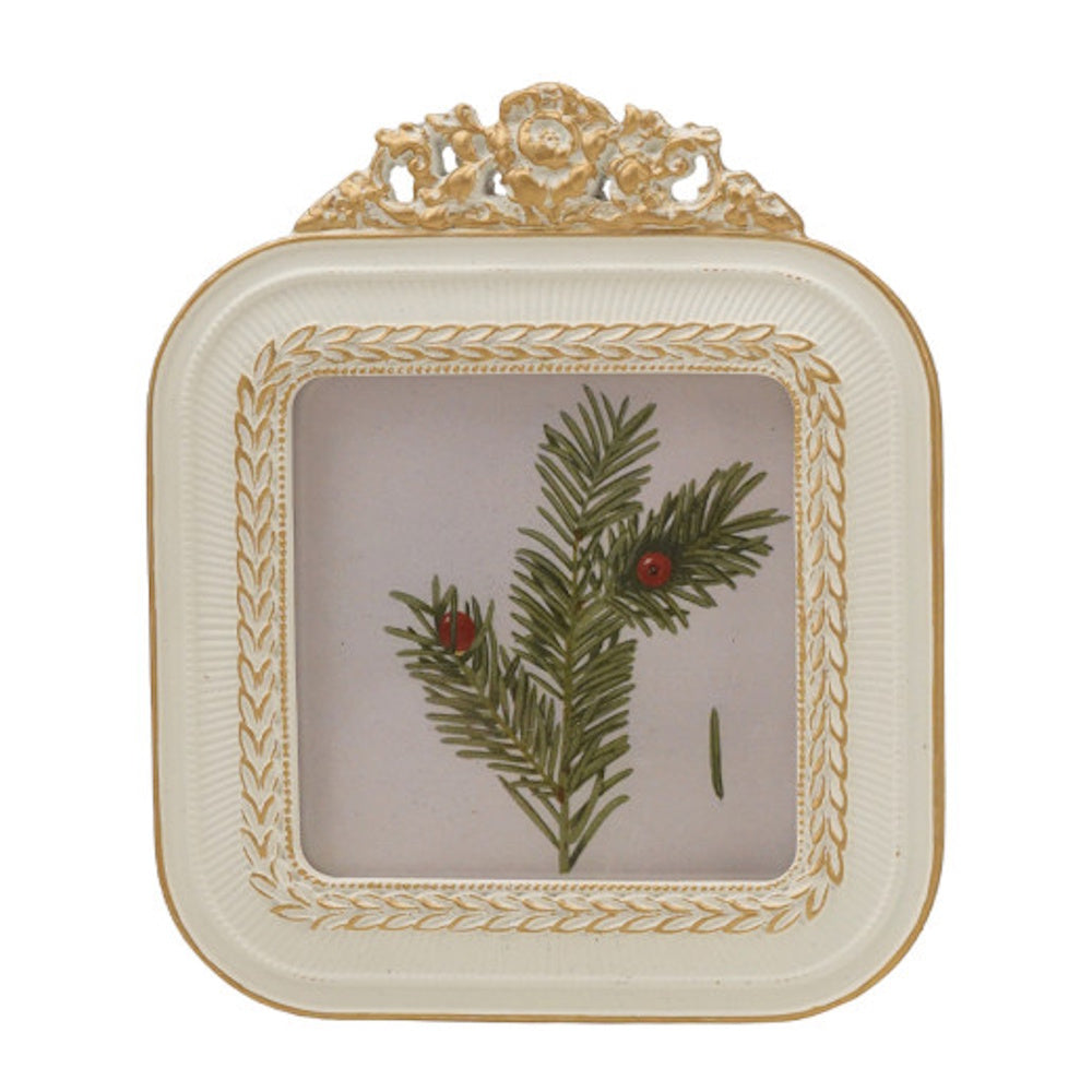 Ornate cream and gold baroque photo frame displaying an illustration of a pine branch with red berries.