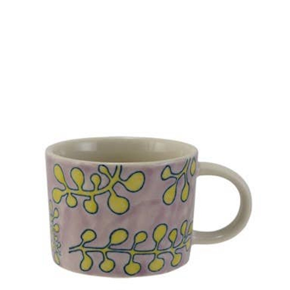 Lavender ceramic mug with a yellow botanical leaf pattern outlined in blue.