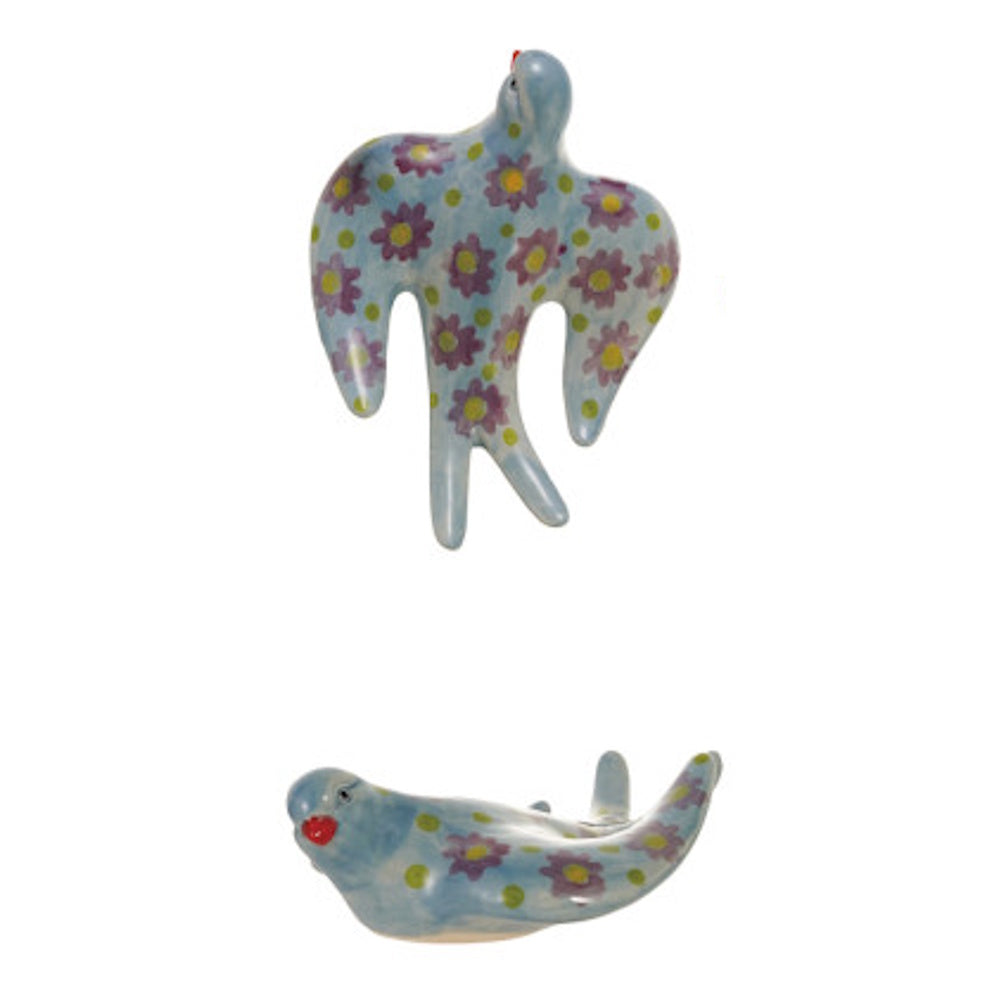 Two light blue ceramic birds decorated with purple flowers and green dots.