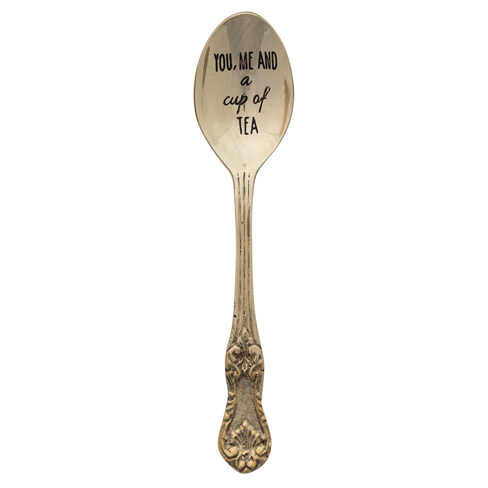 Vintage brass tea spoon engraved with You, me and a cup of tea.