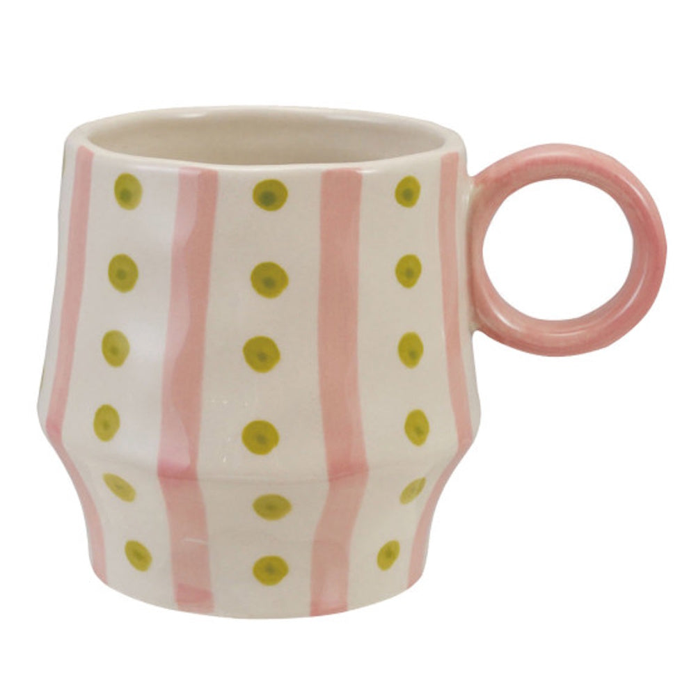 Hand-painted ceramic mug with vertical pink stripes, green dots, and a pink ring handle.