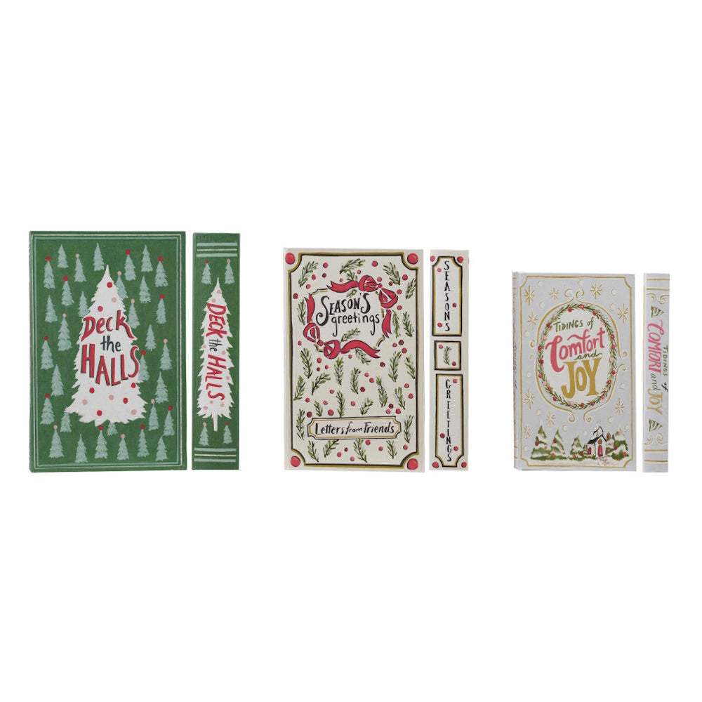 Set of 3 Christmas book-shaped decorative storage boxes with festive holiday artwork.