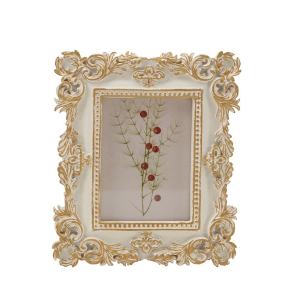 Ornate white and gold baroque photo frame displaying a delicate botanical print with red berries.