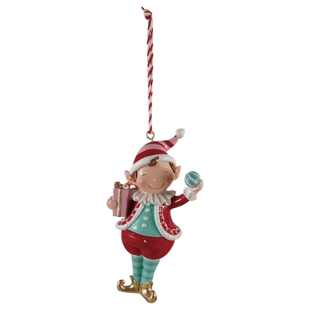 Whimsical holiday elf ornament holding a small gift box and ball, hanging from a striped string.