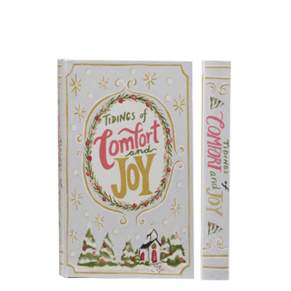 Decorative Christmas book-shaped box reading "Tidings of Comfort and Joy" with festive artwork.