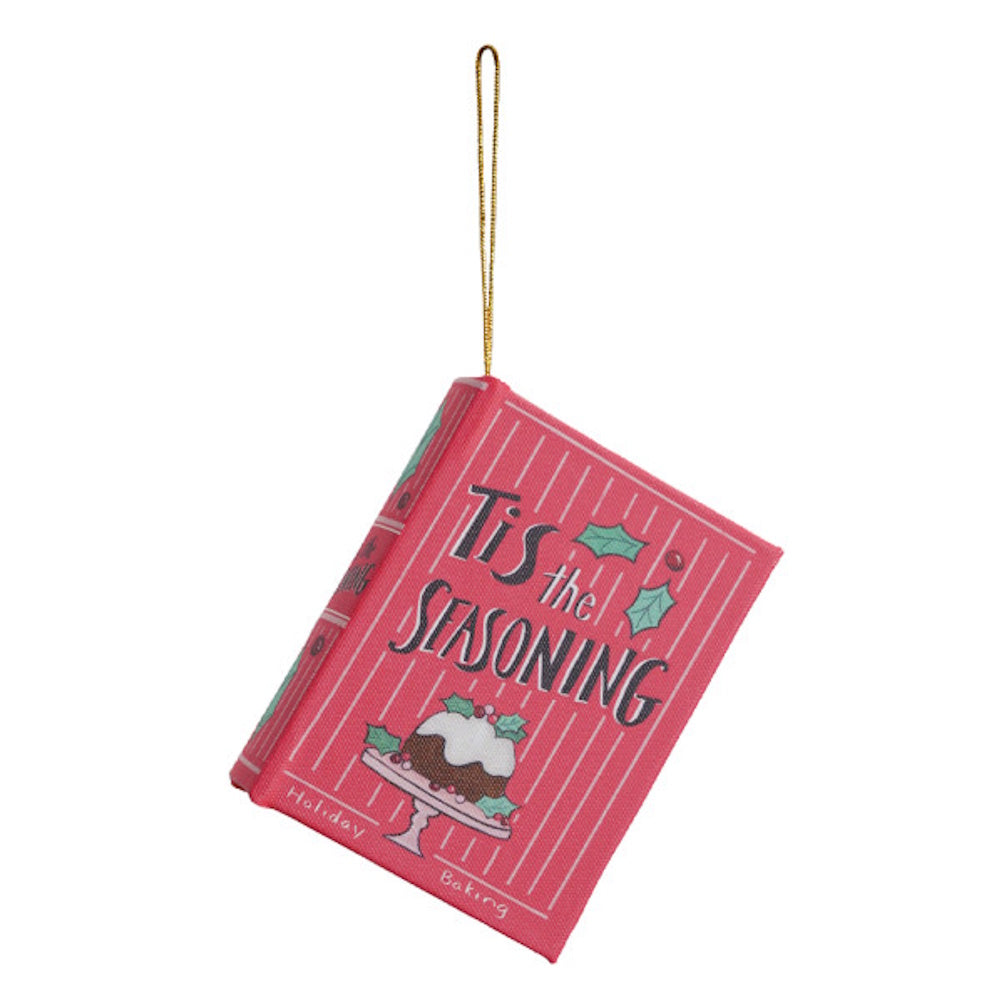 Pink mini book Christmas ornament with gold hanging string, reading "'Tis the Seasoning".