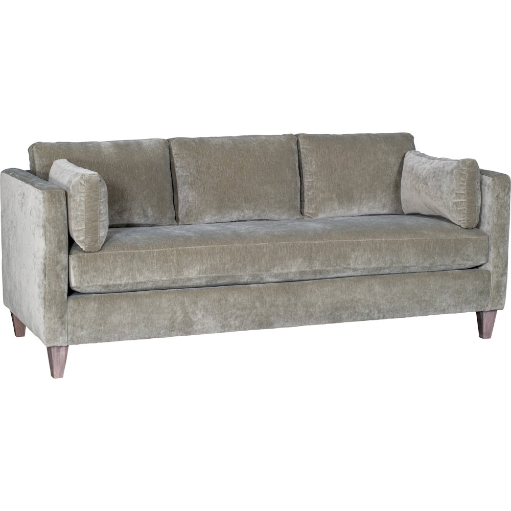 Ou Lala olive green velvet three seater sofa with accent pillows.