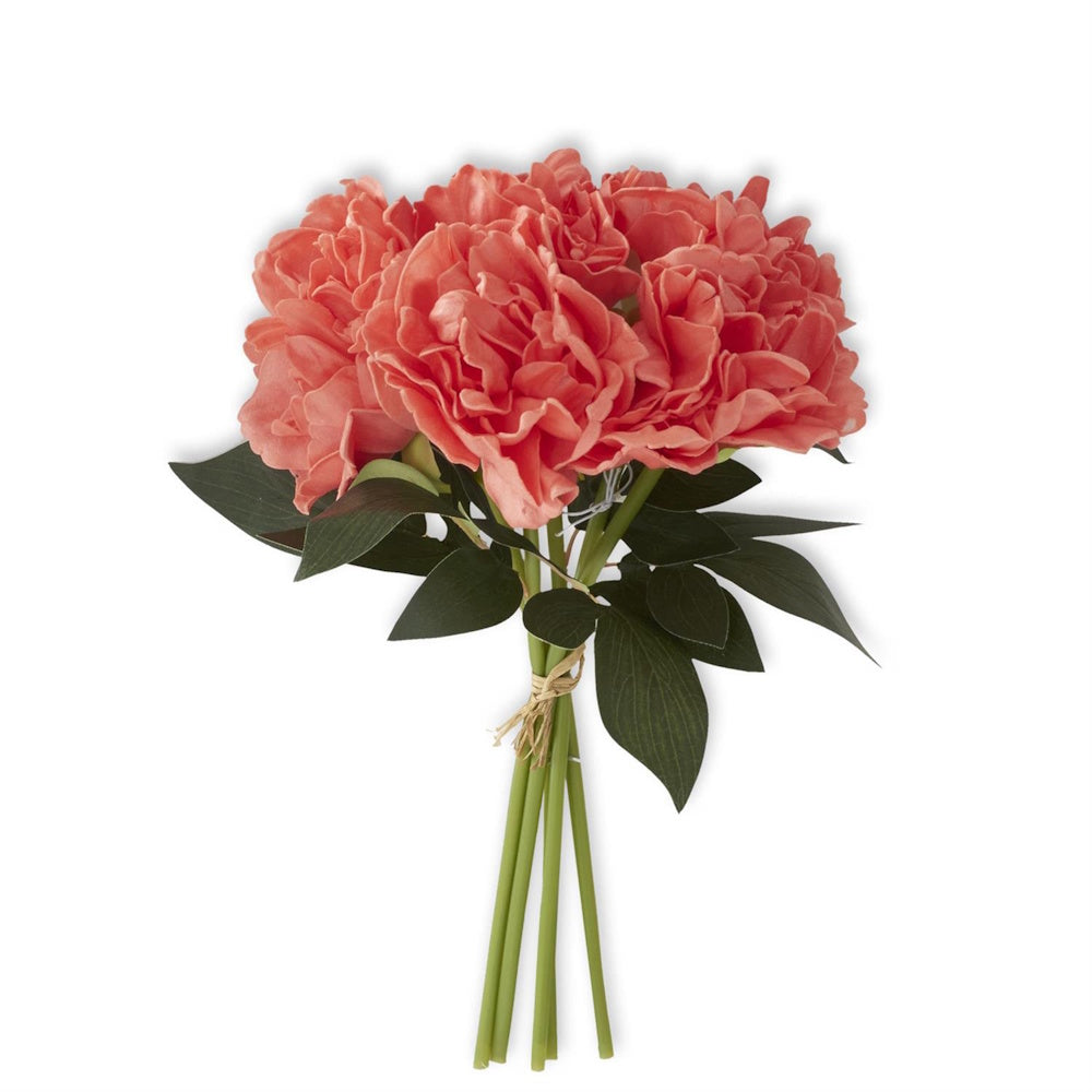 Bundle of artificial coral peonies tied together at the green stems with raffia.