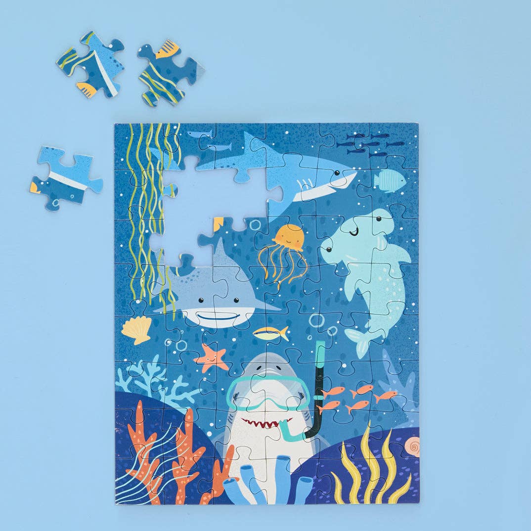 Children's puzzle with underwater theme on a blue background