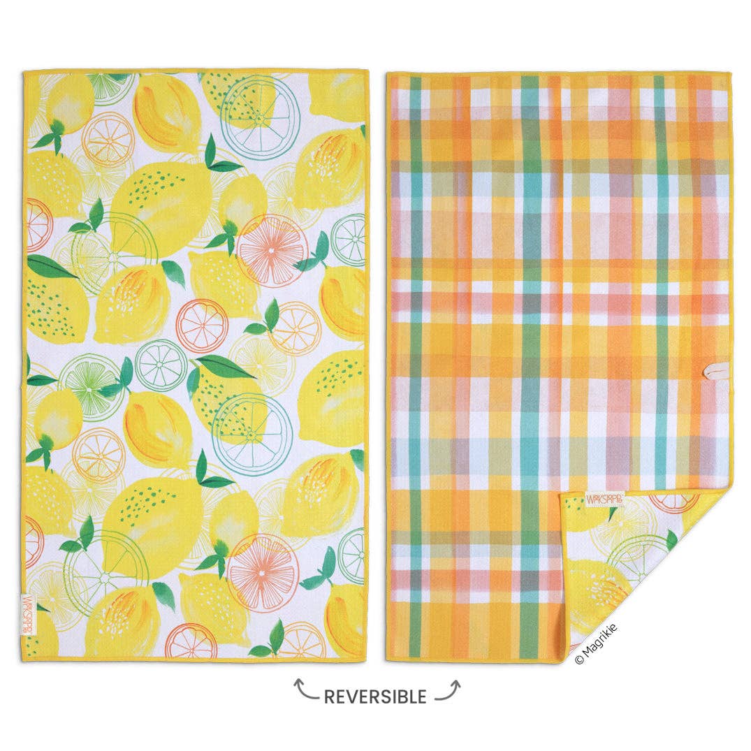 Two reversible kitchen towels, one with lemon pattern and the other with plaid pattern, on a white background.