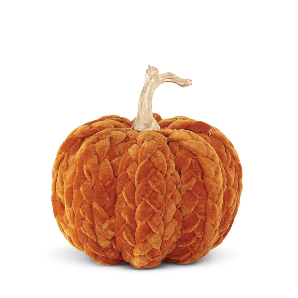 A braided rust-orange velvet decorative pumpkin with a metallic gold stem on a white background.