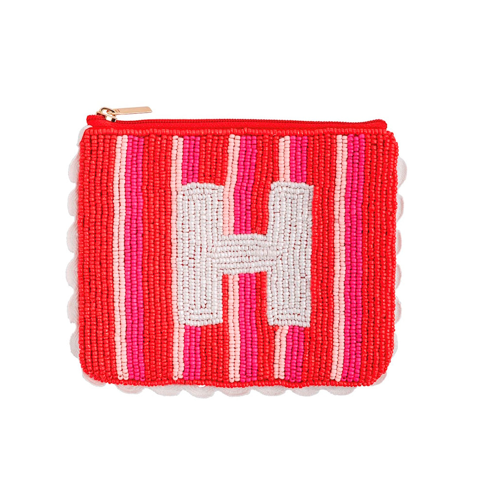 Beaded pouch with red and pink stripes, scalloped trim, and a centered white initial letter H.