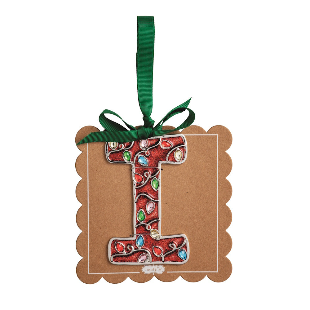 Sparkly red Christmas initial ornament letter I mounted on a scalloped brown card with a green hanging ribbon.