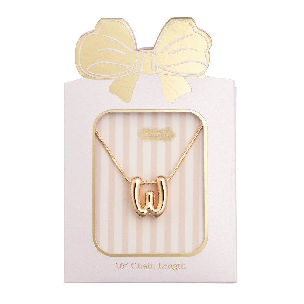 Gold initial "W" pendant necklace packaged in a pink box with a gold bow design.