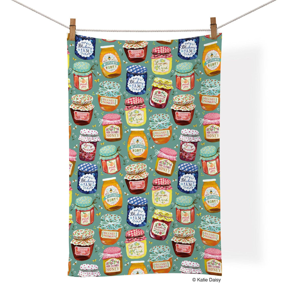 Patterned towel with colorful jam jars on a white background