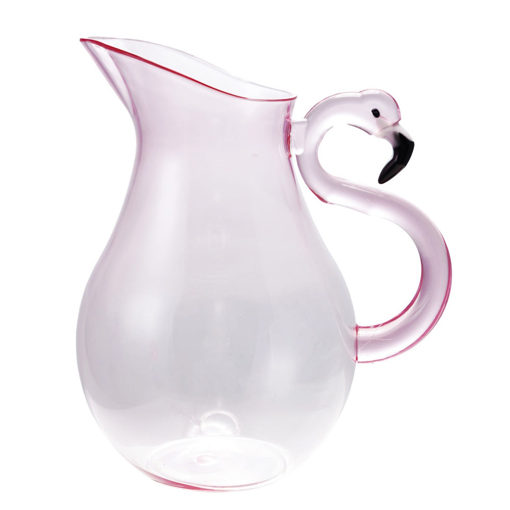 A clear glass pitcher with a pink tint and a decorative handle shaped like a flamingo head and neck.