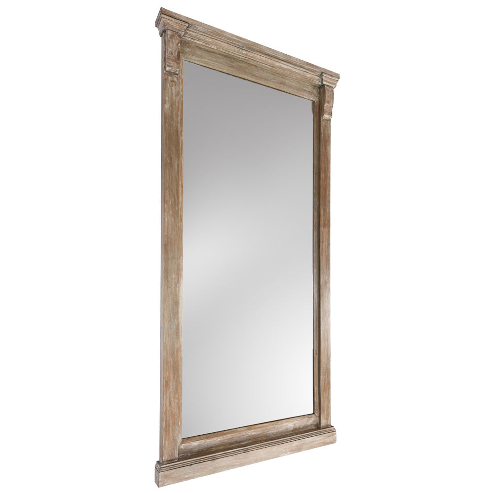 Angled side view of a tall floor mirror framed in weathered light brown wood.