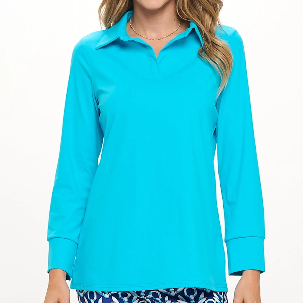 Turquoise long-sleeve polo top with an open collar and cuffed sleeves, paired with patterned blue pants.