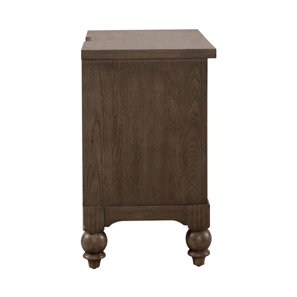 Side profile view of a brown wooden nightstand showcasing natural wood grain and turned bun feet.