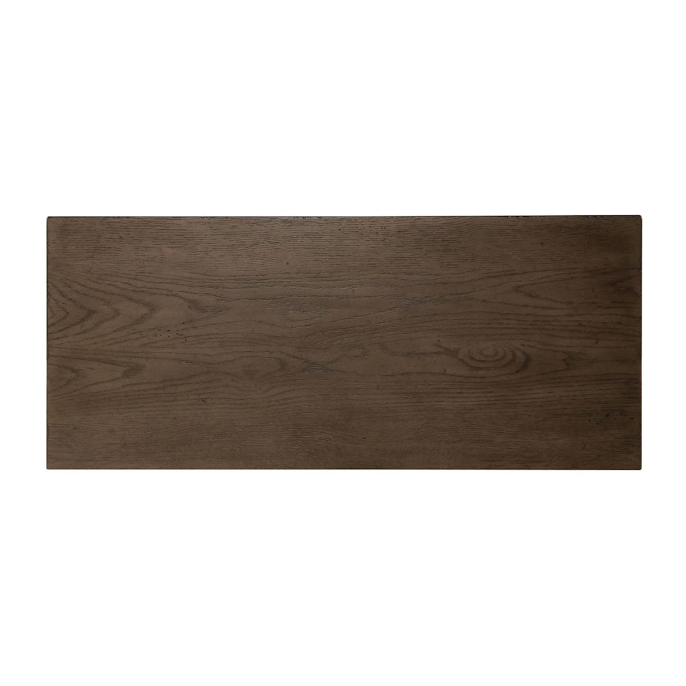 Top-down view of a rectangular brown wooden dresser surface highlighting natural wood grain patterns.