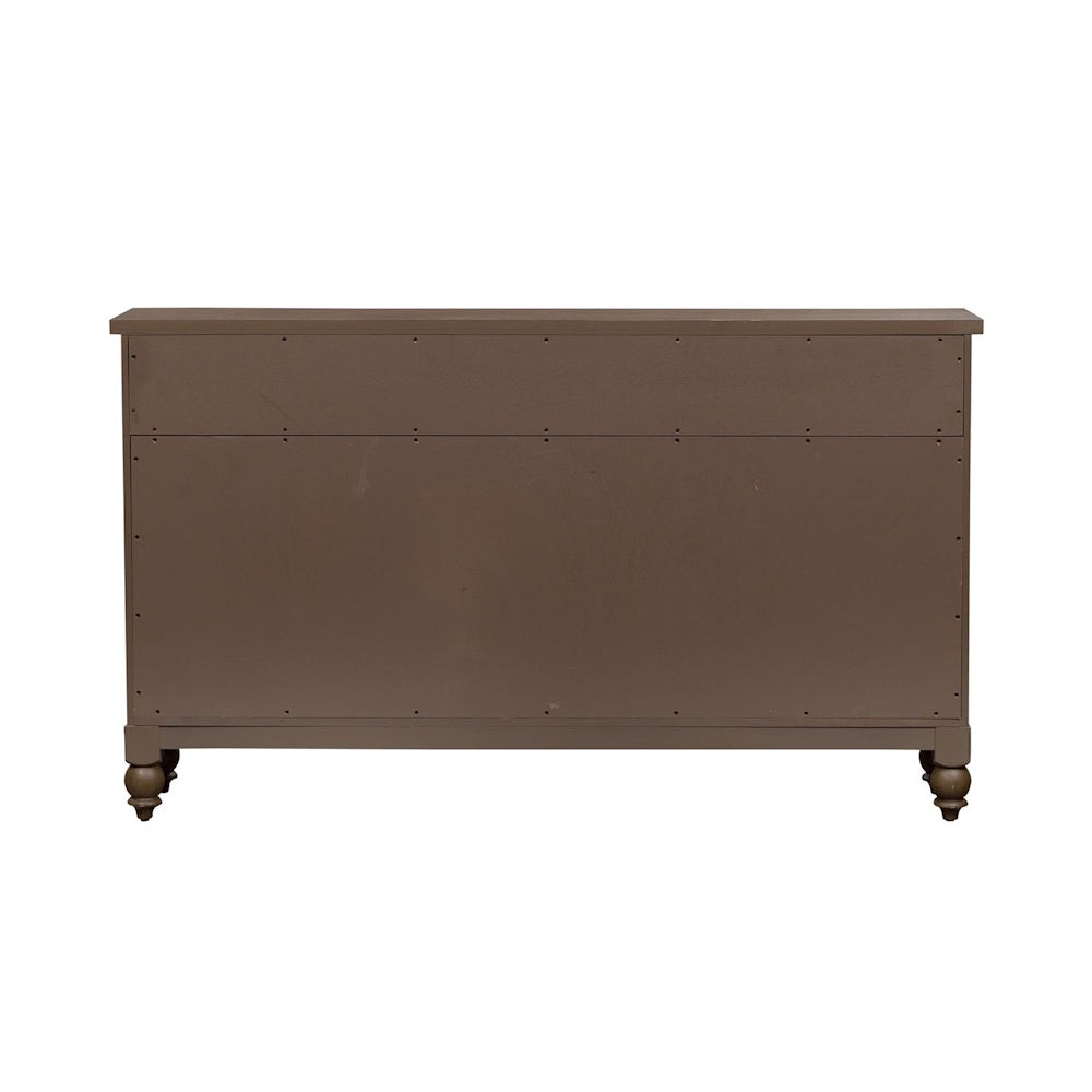 Back view of a flat brown wooden buffet cabinet panel with turned bun feet.