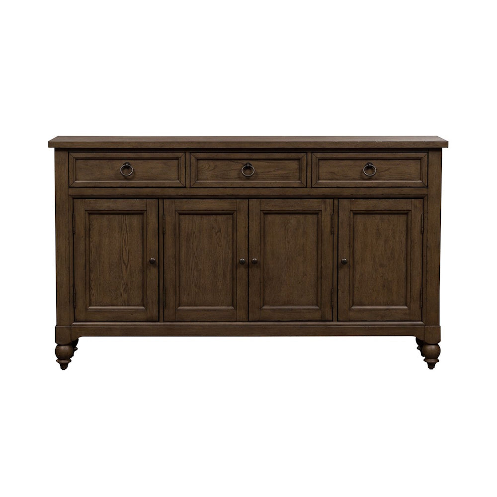 Front view of a brown wooden farmhouse buffet cabinet with three top drawers and four panel doors.