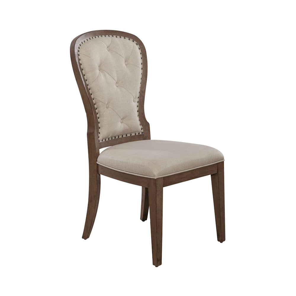 Americana farmhouse upholstered tufted back side chair with a wooden frame and beige fabric.