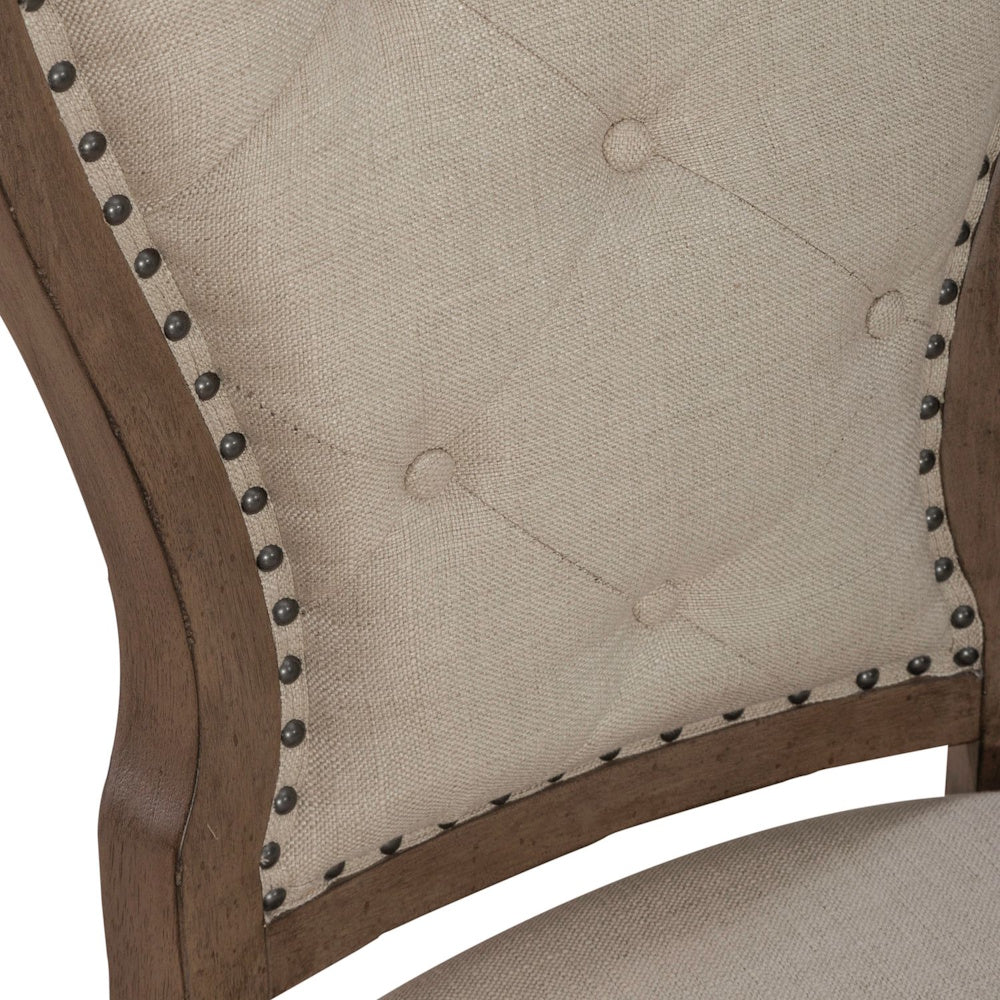Americana farmhouse upholstered tufted back side chair close up with nailhead trim.