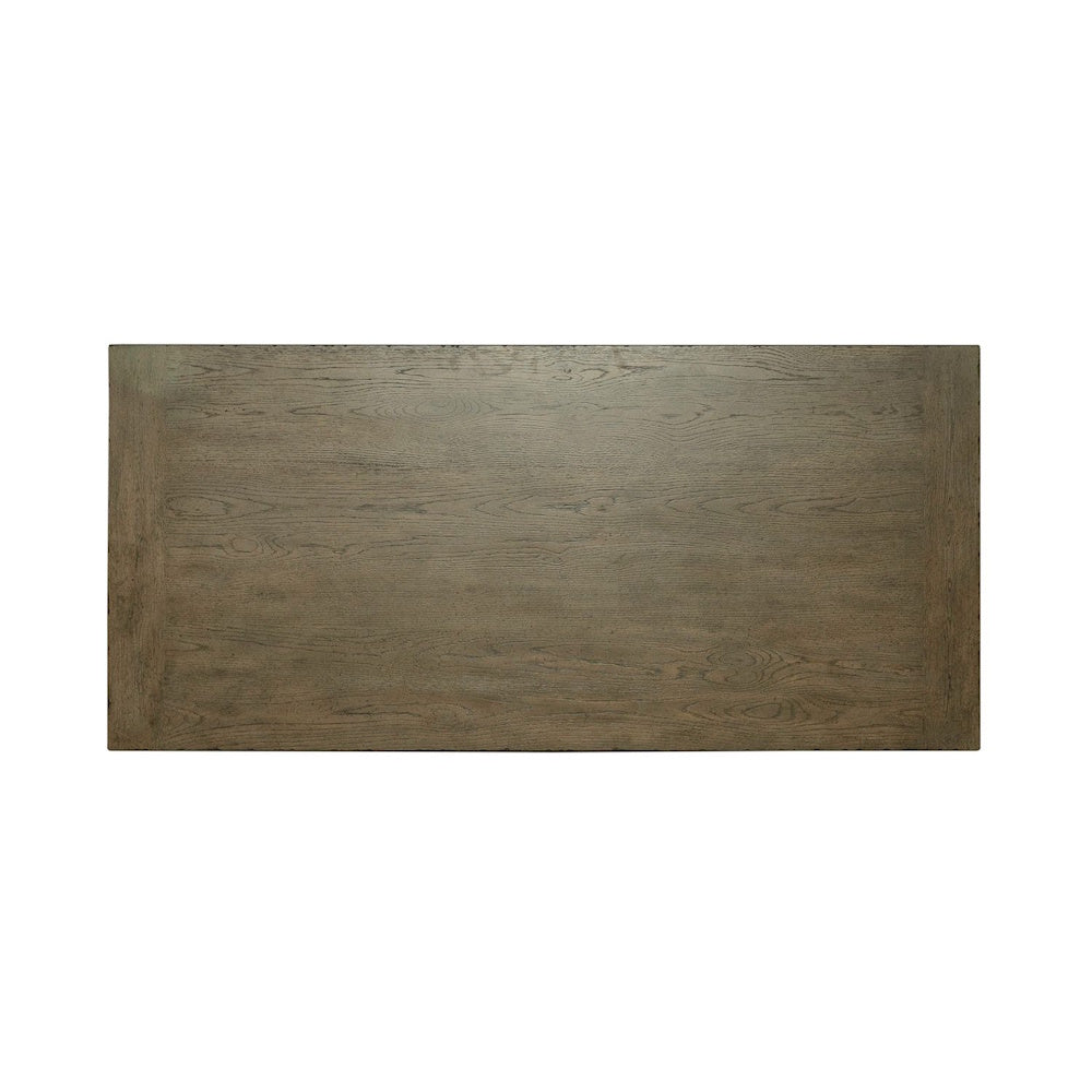 Top-down view of a rectangular brown wooden tabletop showing natural grain patterns.