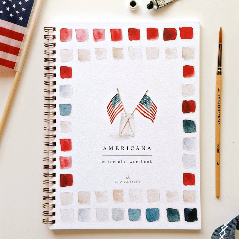 Americana Watercolor Workbook by Emily Lex Studio with red and blue paint swatches and American flags in a jar.
