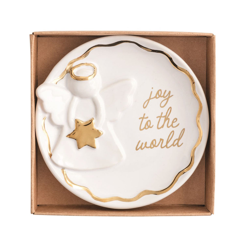 White ceramic trinket dish in a box featuring a relief angel, gold accents, and "joy to the world."