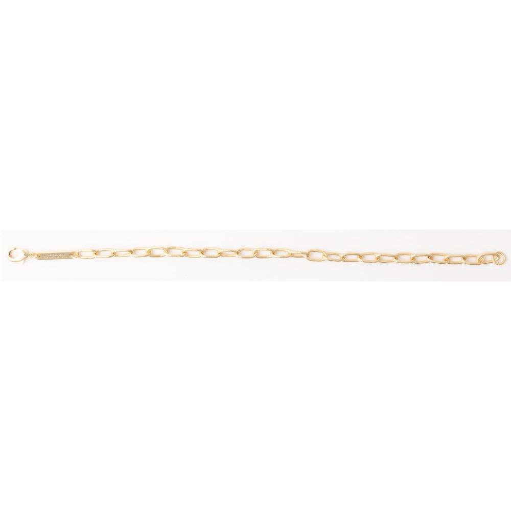 Gold oval link chain bracelet with a lobster clasp and rectangular metal logo tag.