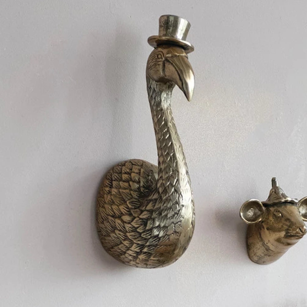 Antique brass flamingo wall decor with top hat, cast aluminum bird head sculpture, quirky vintage style home accent.