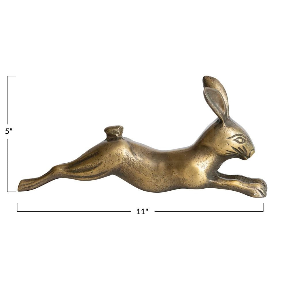 Antique brass cast aluminum rabbit figurine with dimensions: 11 inches long and 5 inches high. Stretching hare decor.