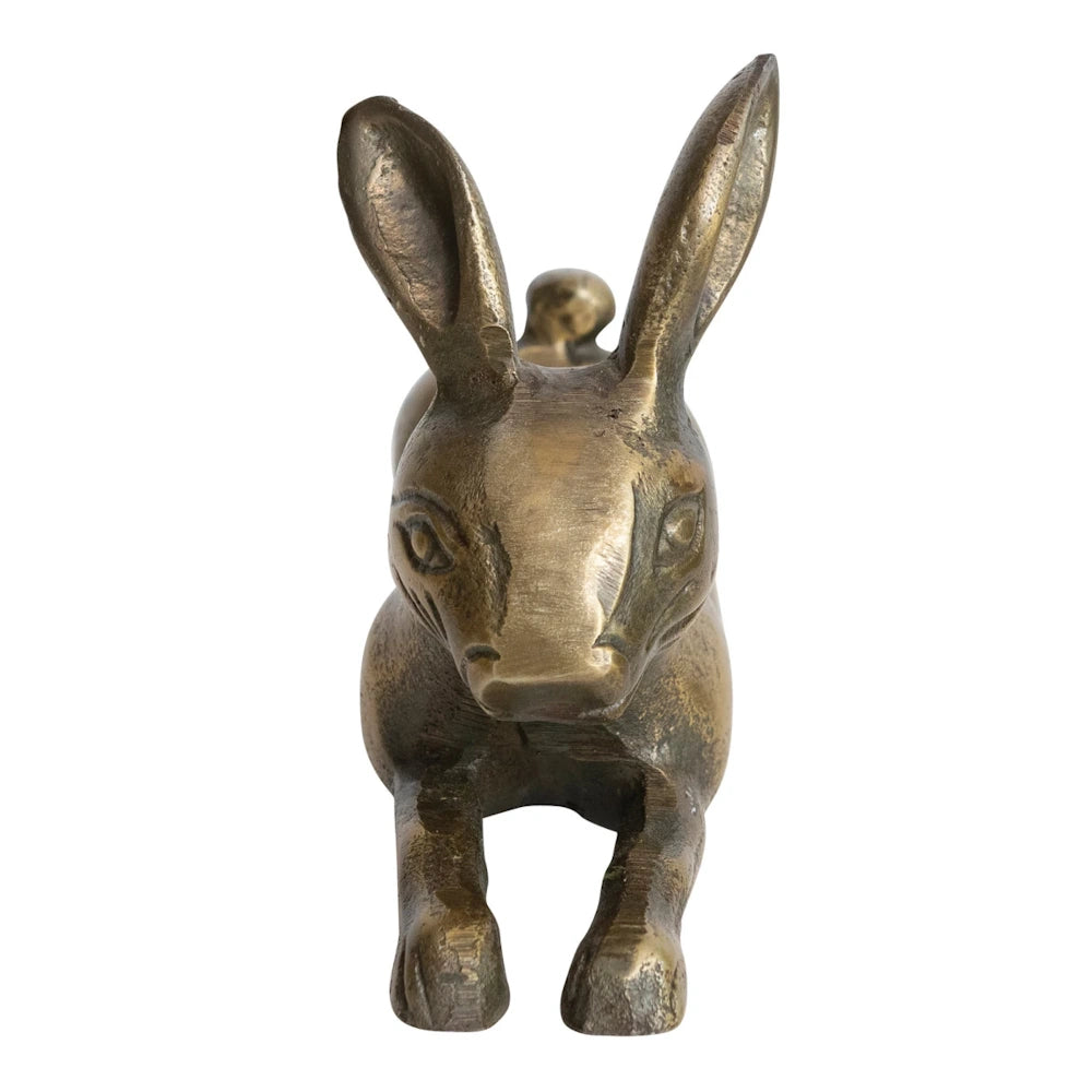 A vintage front view of a tarnished brass hare or donkey figurine in a running pose on white background.