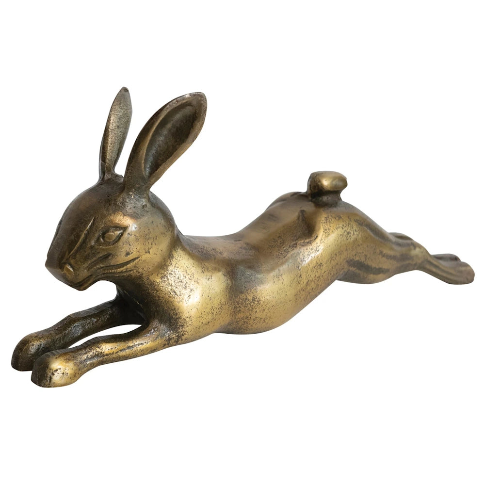 Antique brass finish cast aluminum leaping rabbit figurine, decorative hare sculpture in a stretching pose on white background.
