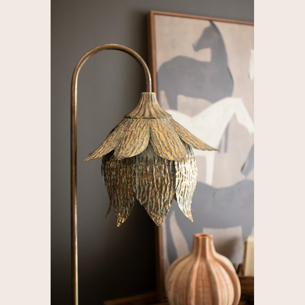 Antique brass floor lamp with a textured tulip-shaped metal shade in a vintage bronze finish.