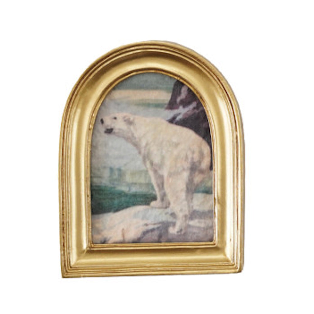 Miniature arched gold frame enclosing vintage artwork of a polar bear in an icy landscape.