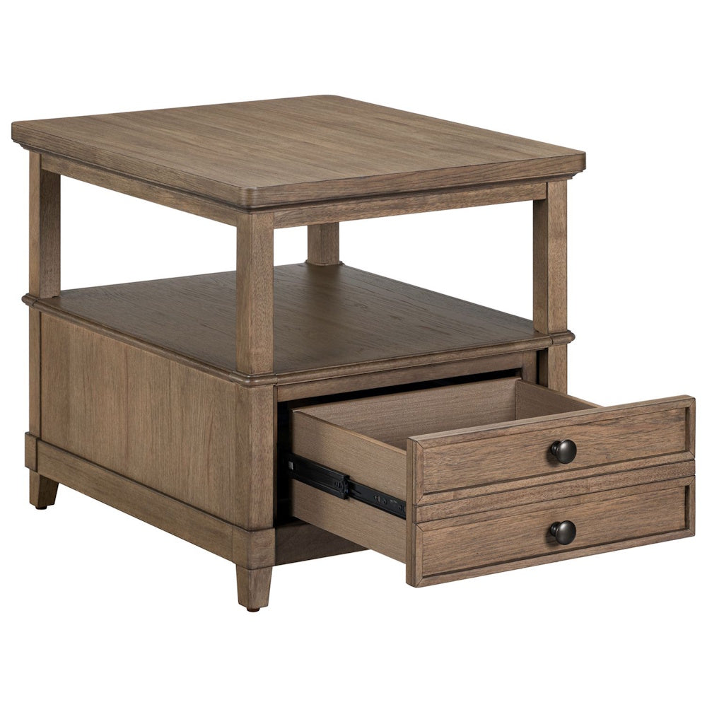 Wooden end table in a natural finish featuring an open top shelf and one open bottom drawer with two black knobs.