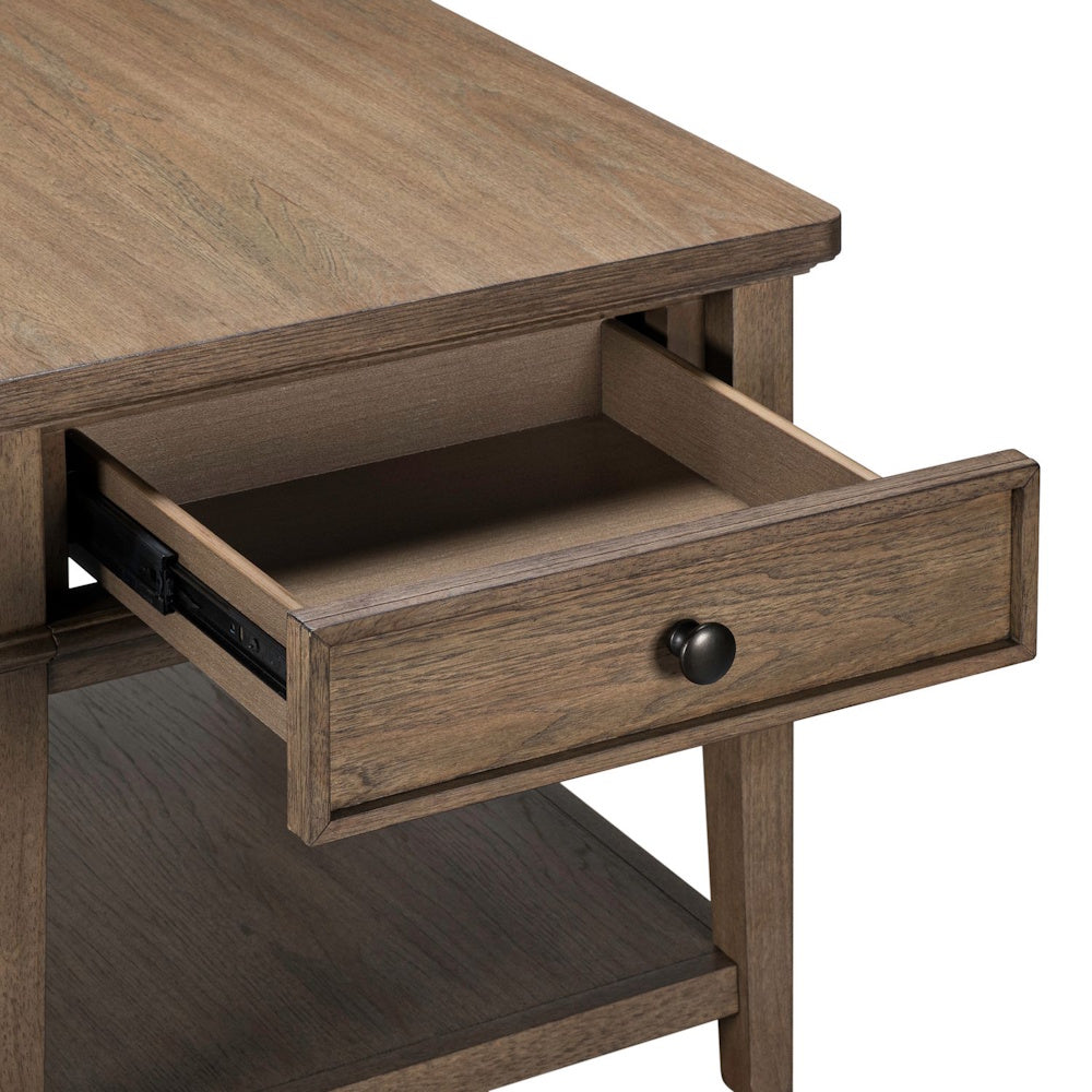 Close-up view of an open wooden end table drawer with a natural finish, metal glides, and a round black knob.