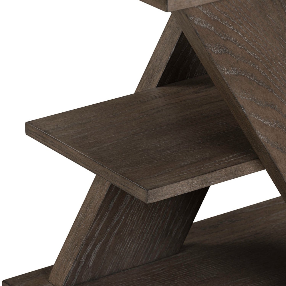 Close-up of a rustic brown wood chairside table featuring a modern Z-frame design and open storage shelf.