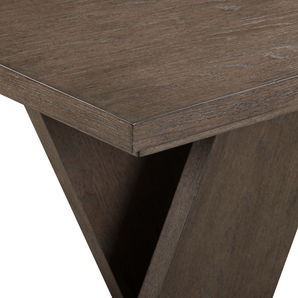 Close-up of a rustic brown wood end table with a visible grain finish and a geometric, angular base design.