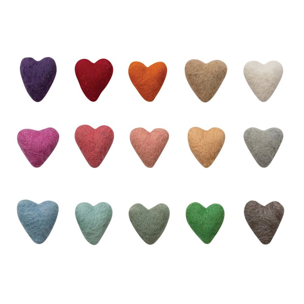 A grid of 15 small, fuzzy wool felt hearts in various colors including purple, red, pink, green, and brown on a white background.