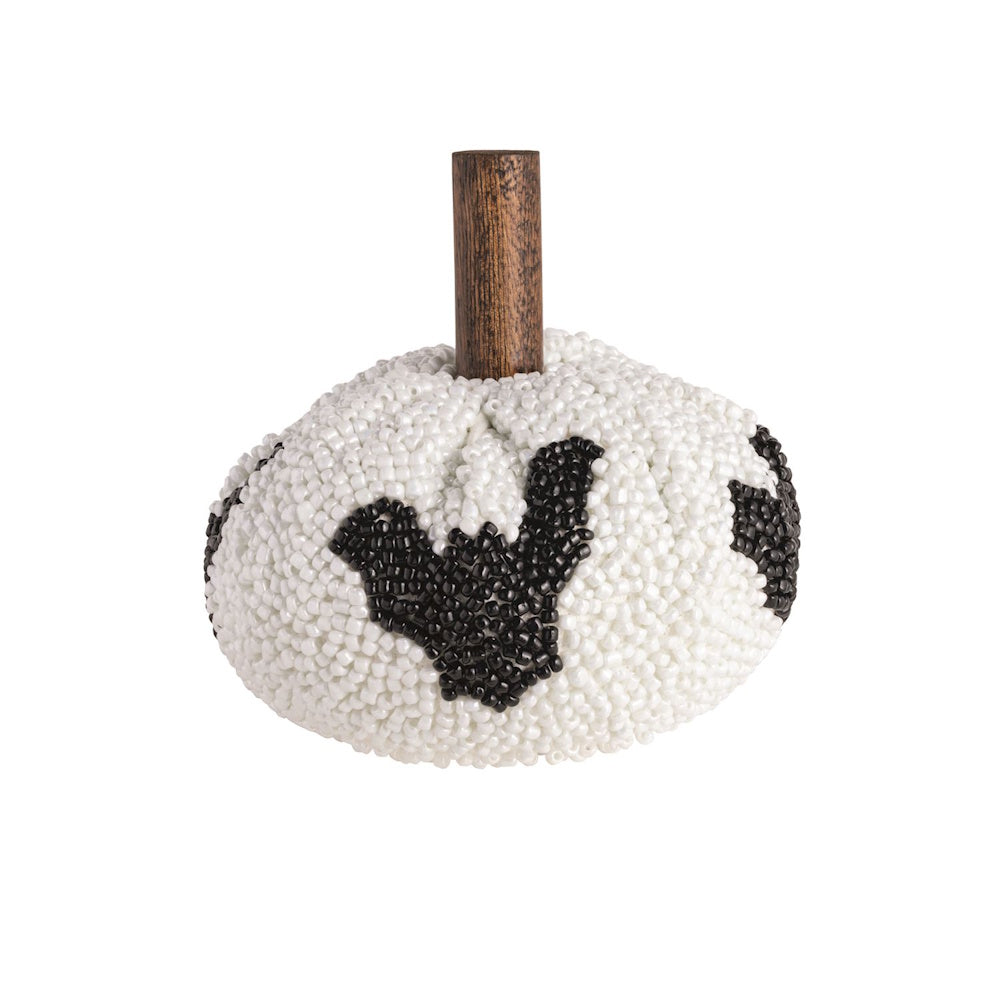 White beaded decorative pumpkin with black bat motifs and a wooden stem.