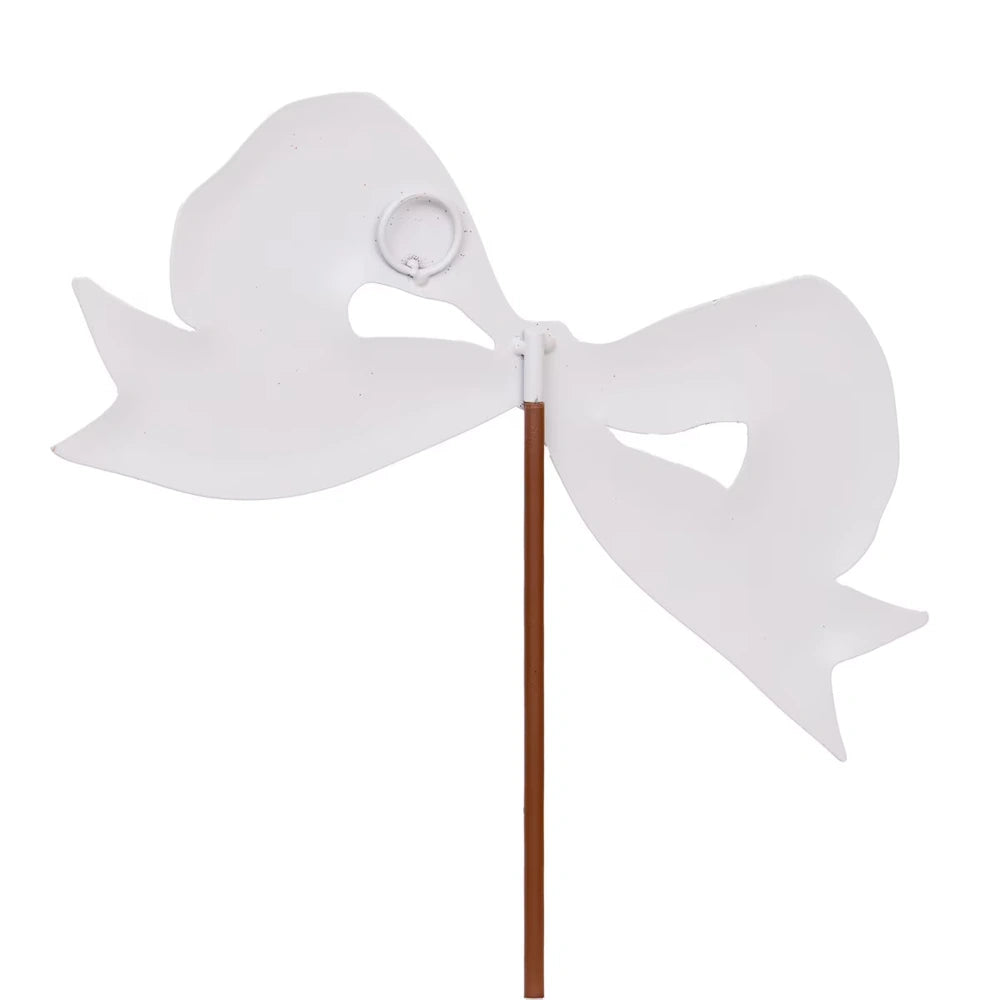 White metal bow garden stake decoration for outdoor yard and lawn decor.
