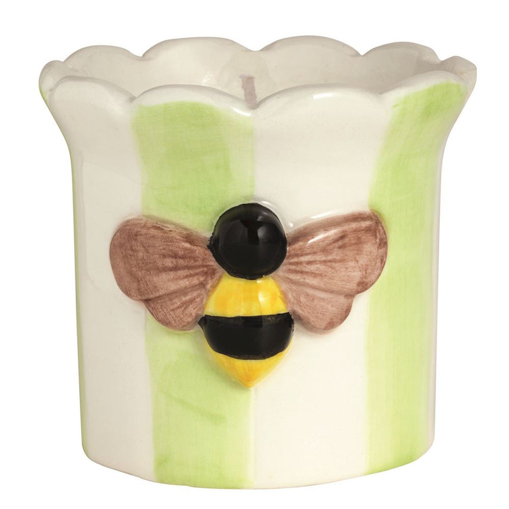 Ceramic bee candle holder with green and white stripes and a scalloped rim.