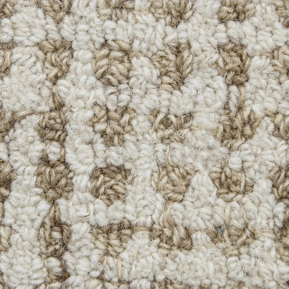Textured beige and cream patterned loop pile carpet swatch for home flooring design.