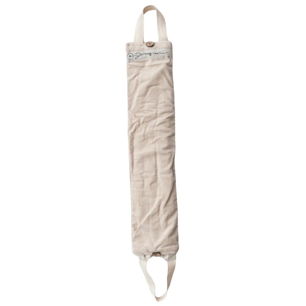 Beige fabric microwavable hot and cold neck wrap with handles and button closures for heat therapy and pain relief.